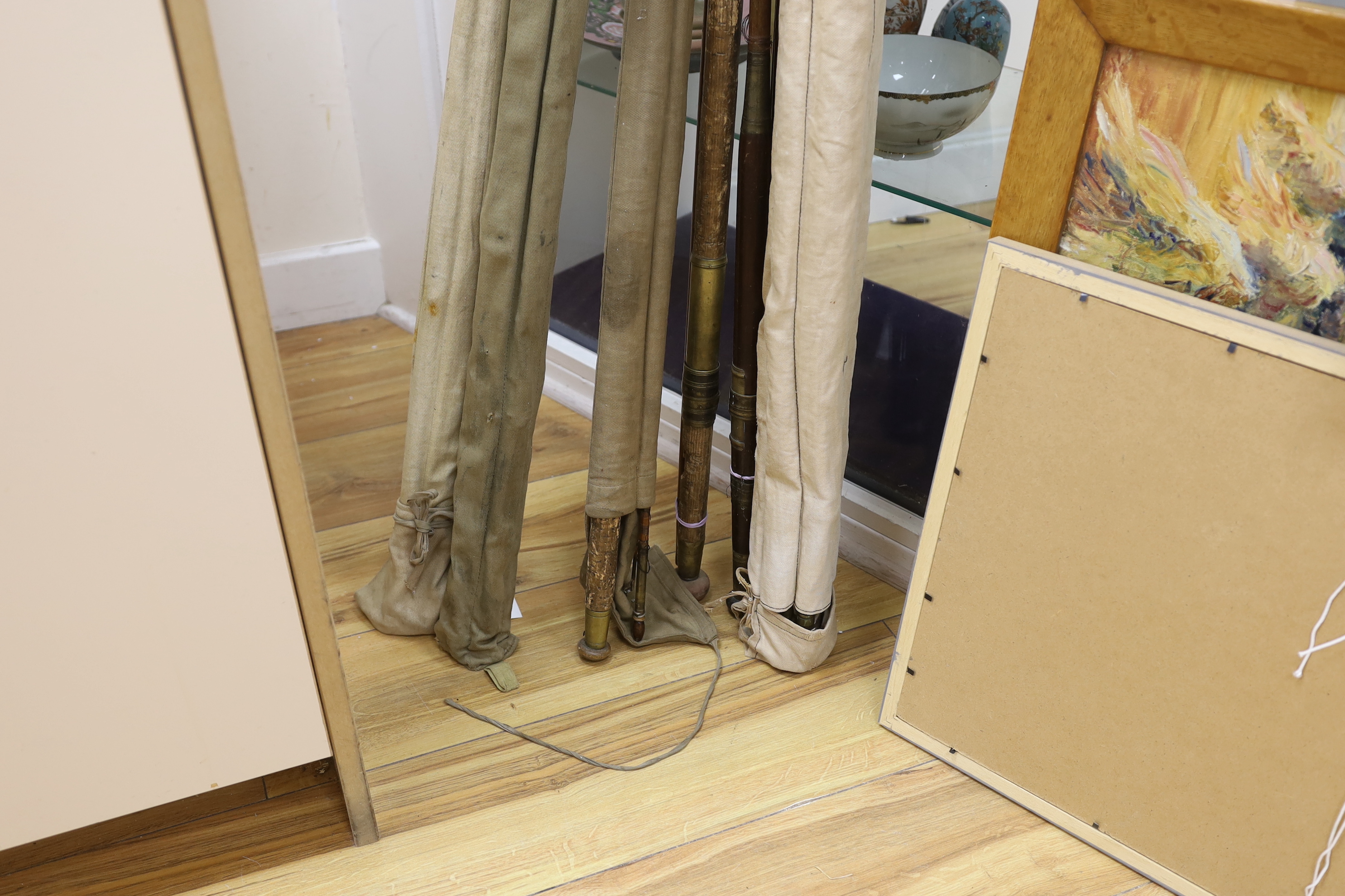 A Hardy fishing rod dated 1951 with cover, a Thorburn and four others, four rods in canvas covers (6)